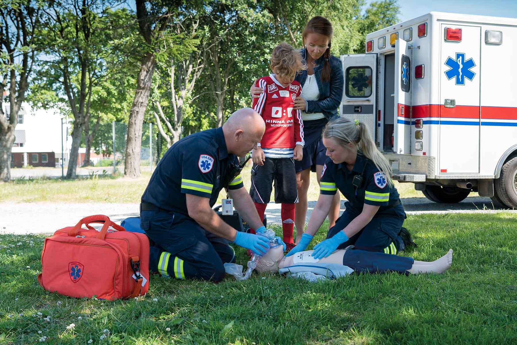 emts performing resuscitation on resusci junior manikin in situ