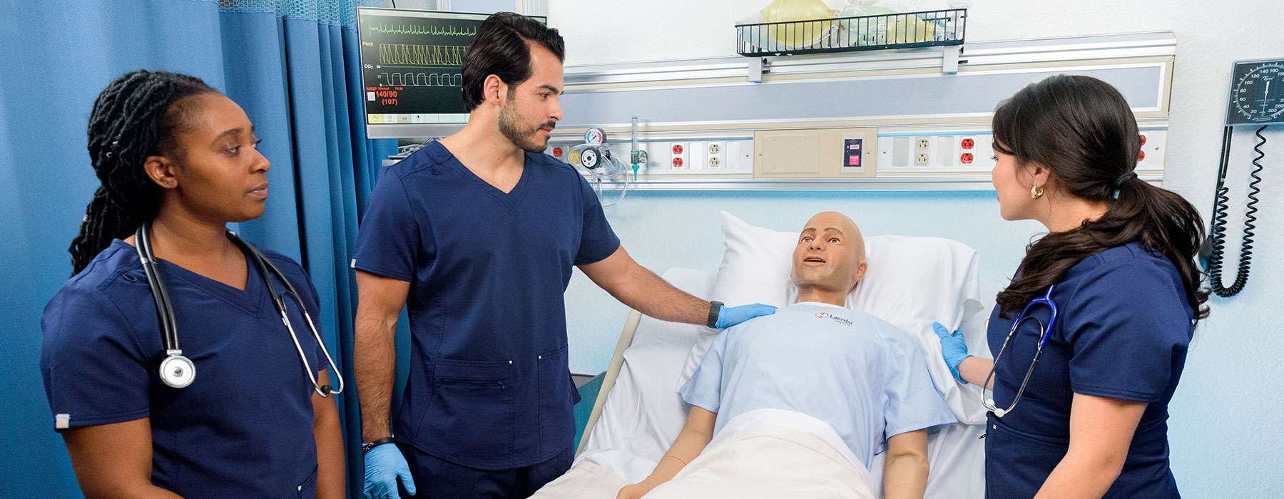 Students using nursing anne simulator male