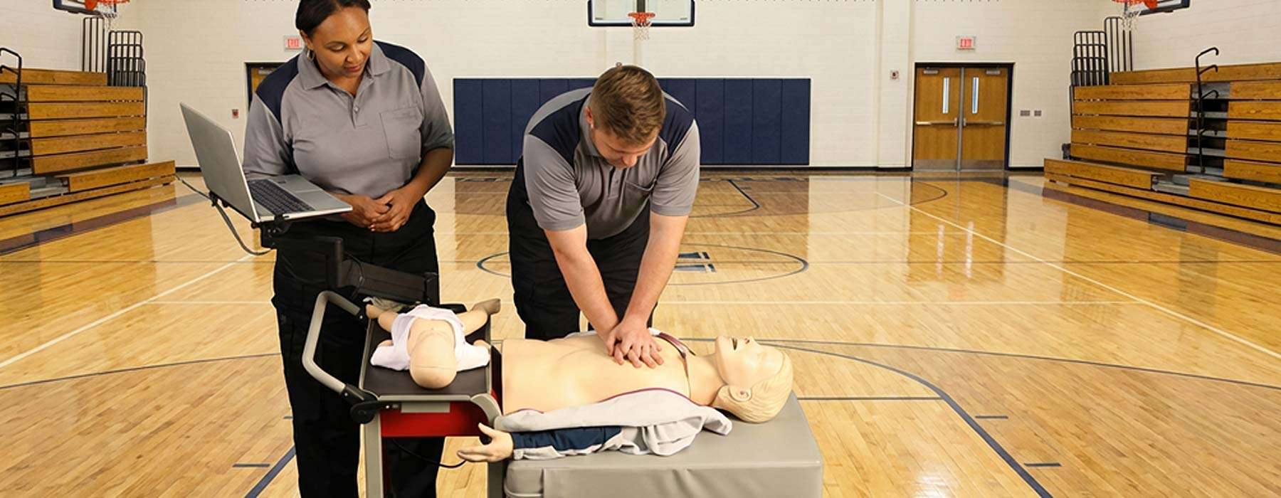peforming cpr with an rqi cart inside a gymnasium
