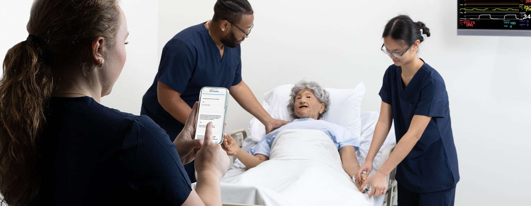nursing-assessment.jpg A clinical instructor uses the SimCapture mobile app to evaluate students during a geriatric patient simulation with a high-fidelity manikin.