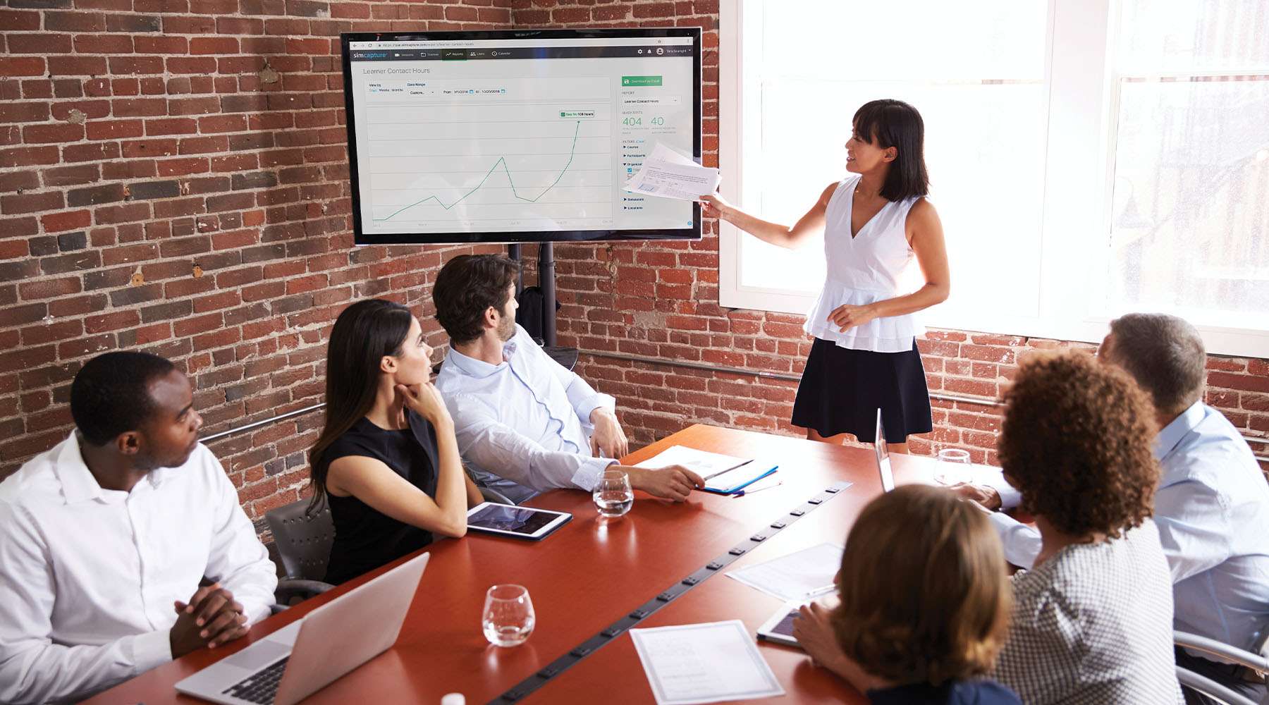 Group of students in a debrief meeting after using SimCapture