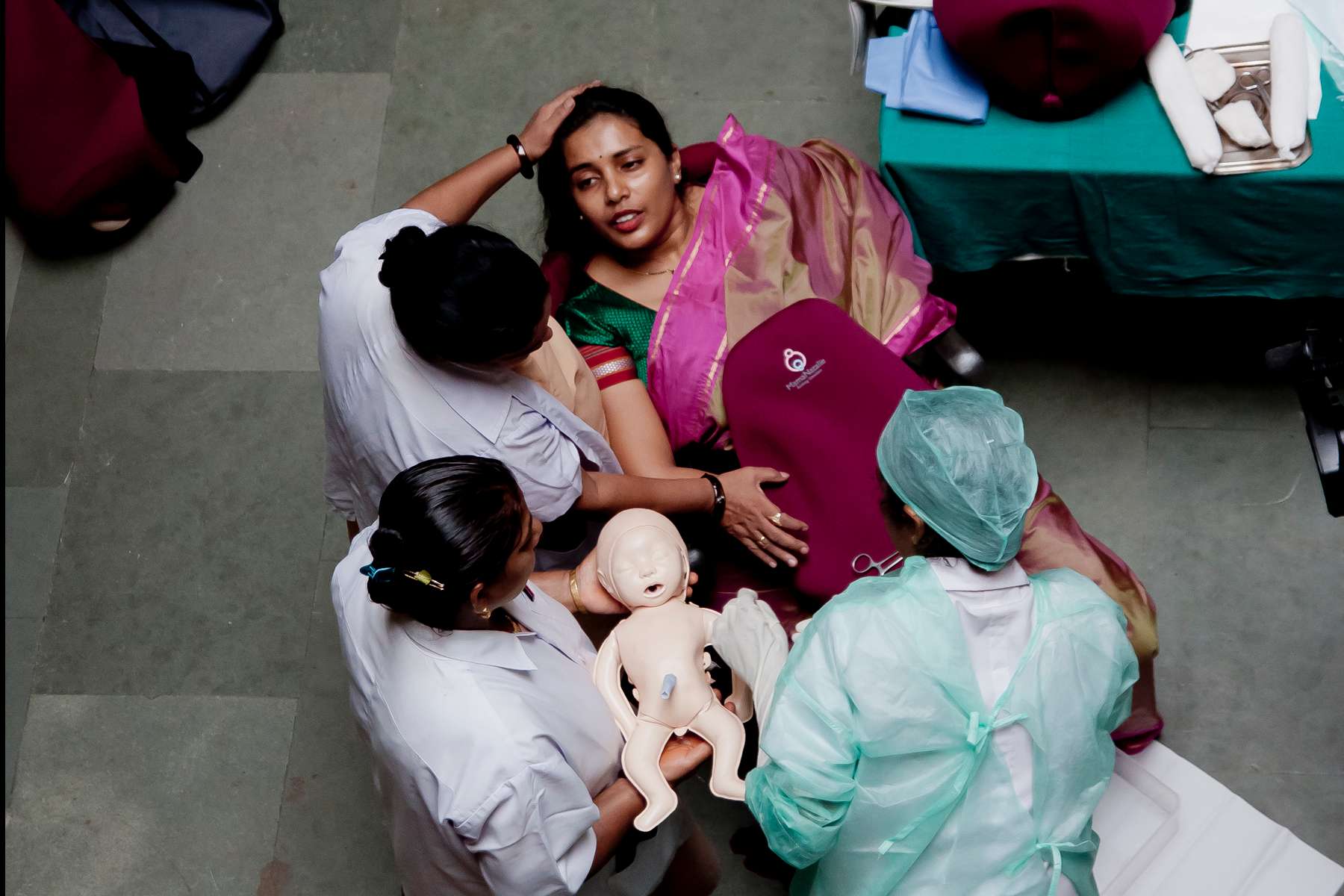 Nurses train on a Laerdal Global Health Mamma Natalie simulator