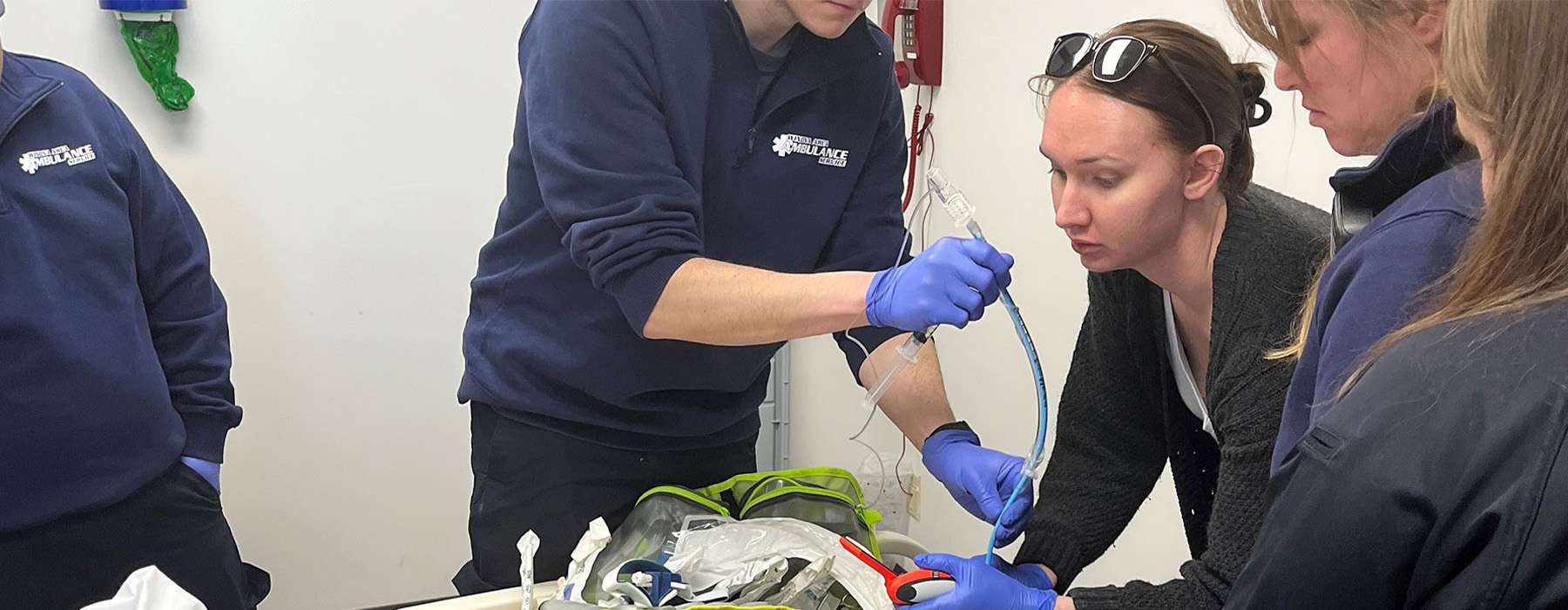 Team of workers doing simulation training on a SimMan