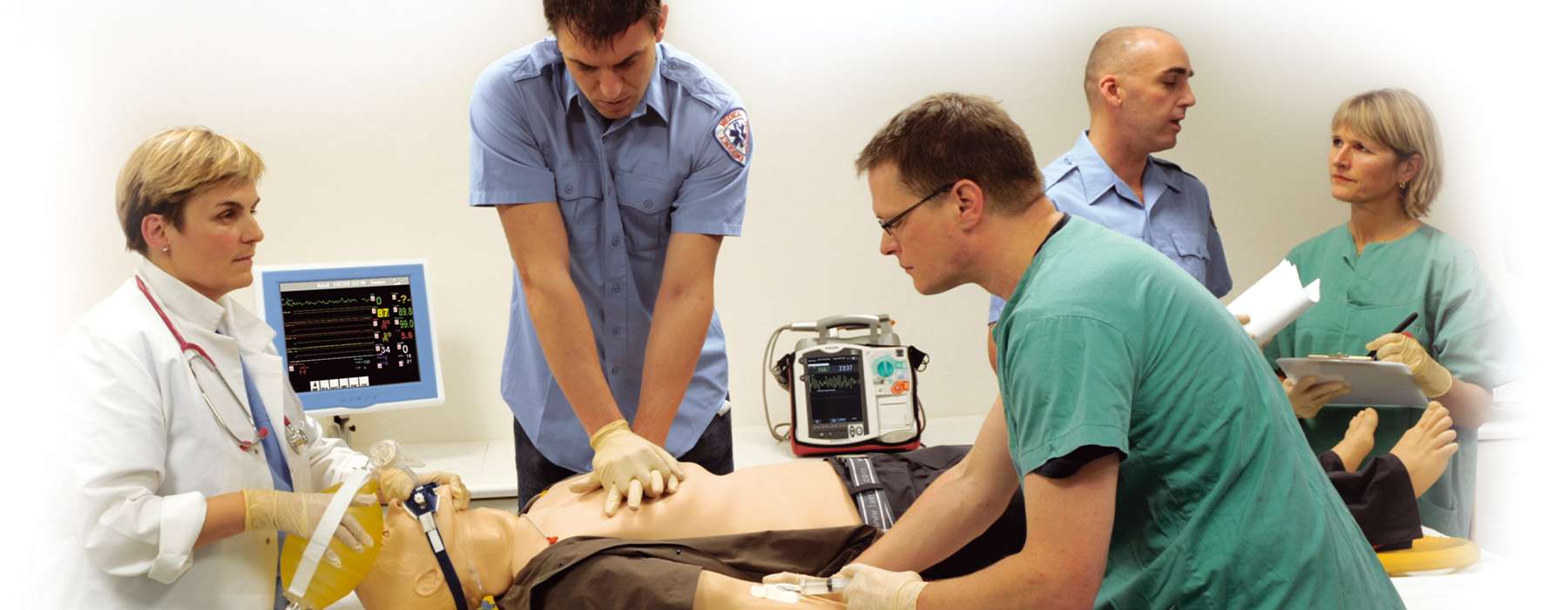 Team of different professionals working on a SimMan simulation training.