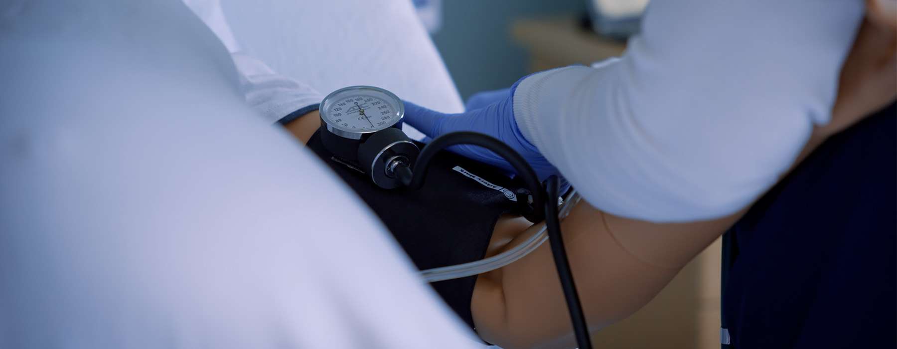 Practicing measuring blood pressure on MamaAnne