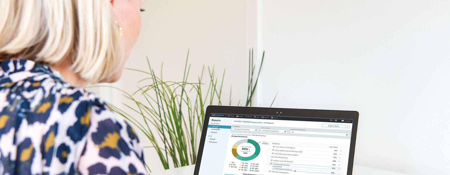 A close-up view of a laptop screen displaying a reporting dashboard with performance metrics and data analysis.