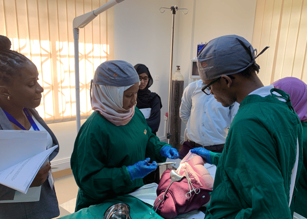 A surgical team practices with Laerdal Global Health training devices