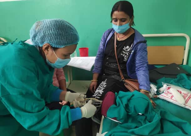 A midwife practices on a Mamma Natalie training device in rural Nepal